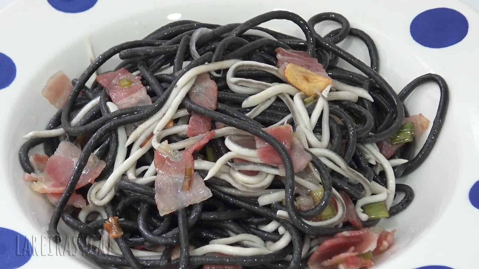 Sautéed black spaghetti with bacon and surimi elvers