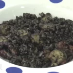 Polbo en tinta con arroz